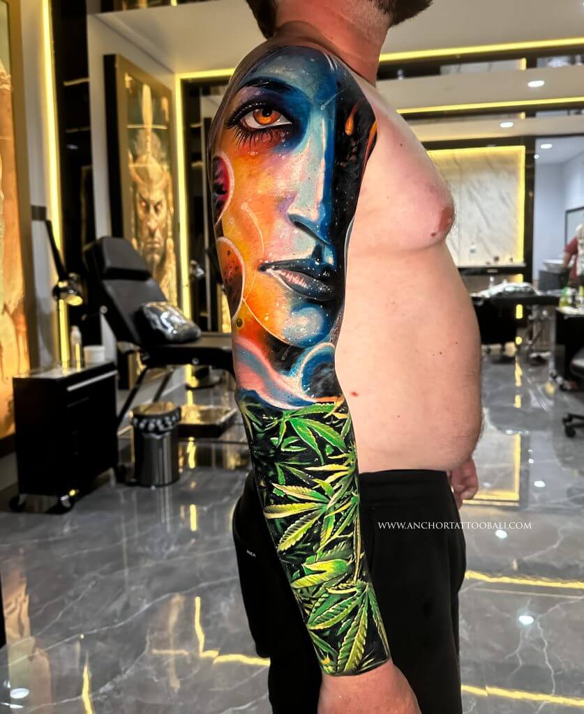 abstract face full sleeve tattoo
