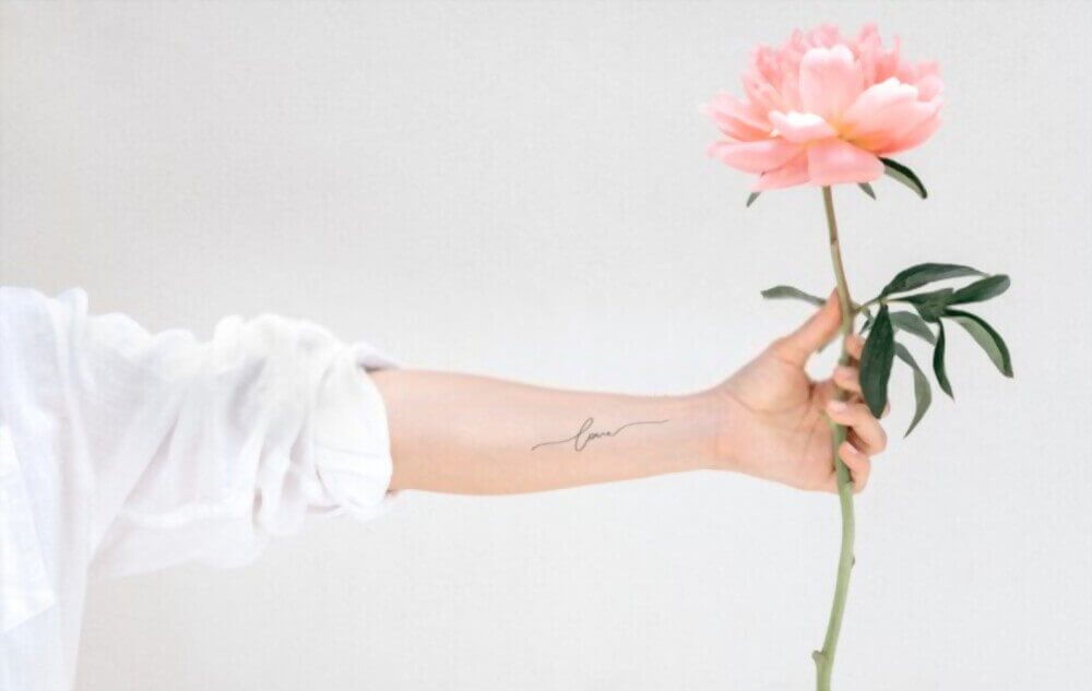 simple word tattoo design by custom tattoo shop - image